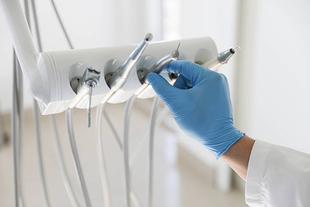 Professional Tooth Extraction technician working in San Carlos Park, FL